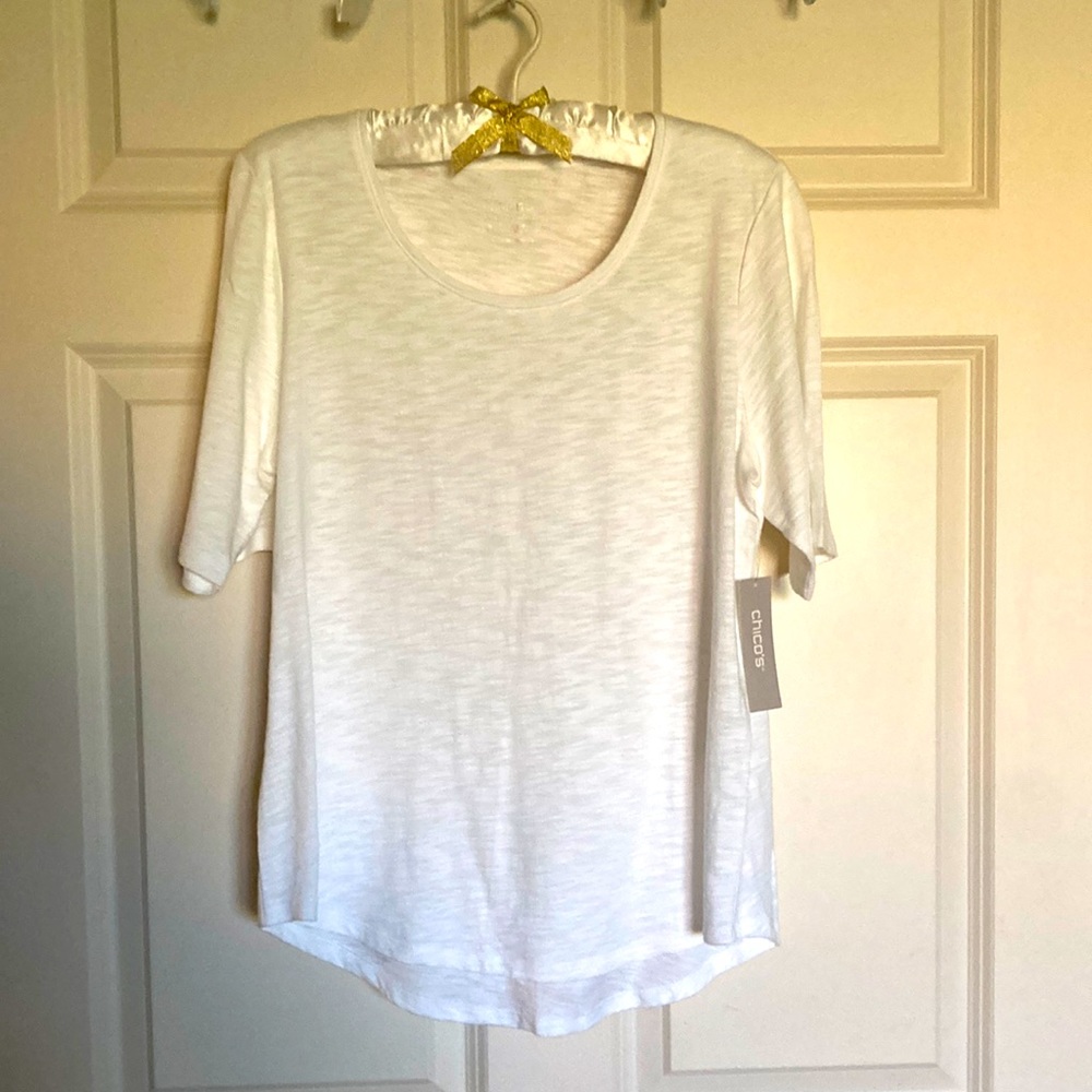 White dressy”T” style up/down. Do a front tuck to be on-trend.  Great for vacay!